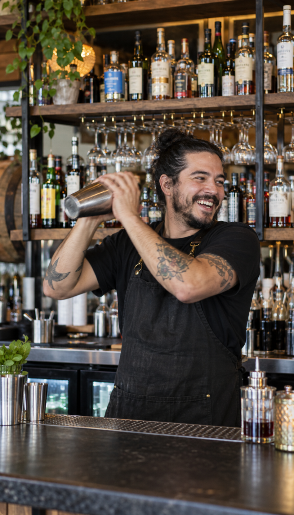 A bartender working a busy bar